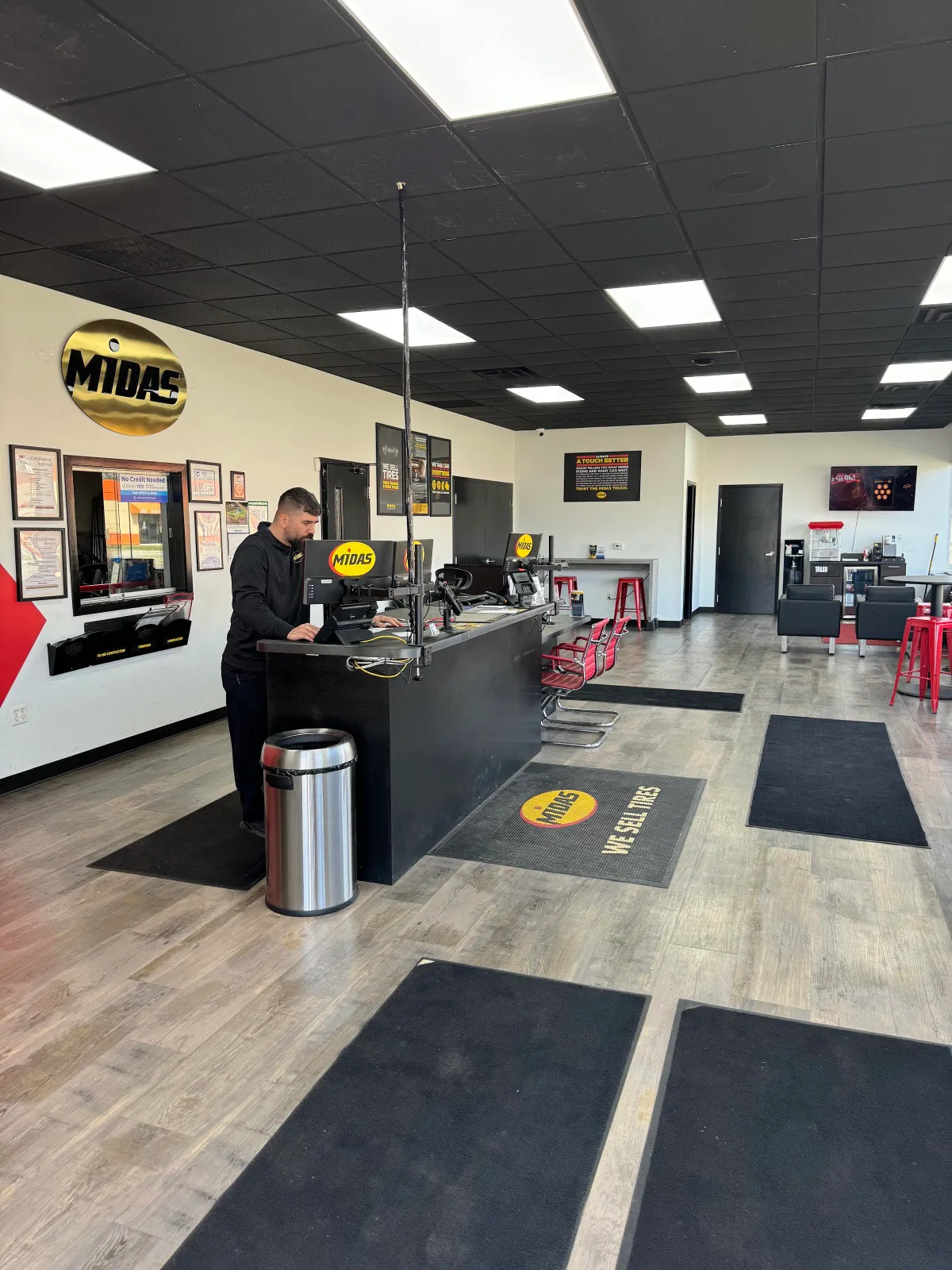 Service advisor at the front counter in the Midas Redford lobby on Plymouth Rd